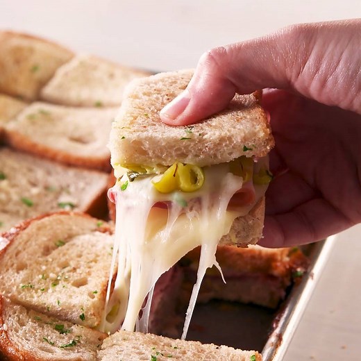 Sheet-Pan Italian Subs are the EASIEST way to feed a hungry crowd. Full recipe: http://dlsh.it/eNLDuag | Delish