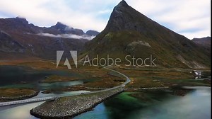 Vehicle crossing Fredvang Bridge that connects islands, Lofoten Islands, Norway