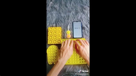 Playing yellow pop it satisfyingly