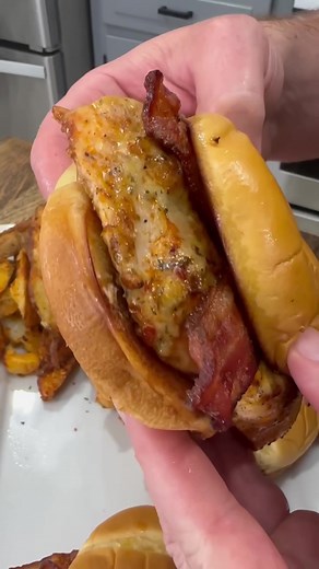 Garlic Parmesan Chicken Sandwiches don’t disappoint! Recipe 2 chicken breasts Salt, pepper, garlic powder, paprika 1 TBSP olive oil Buffalo Wild Wings Garlic Parmesan Sauce 4 Buns 1 TBSP Butter 8 pieces of cooked bacon Parmesan Cheese for topping Steps -Cook Bacon. -Butterfly cut chicken breasts to make them thinner. -Season with a little bit of salt, pepper, garlic powder, and smoked paprika on both sides. -Heat skillet with 1 TBSP of oil and quickly sear chicken in the skillet on both sides. T