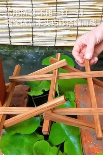 5.6K views · 64 reactions | No nails, no glue, no supports—just 9 chopsticks and pure genius. A Chinese netizen recreated the iconic arched #bridge from Along the River During the Qingming Festival, and yes, it holds real weight. #culture #architecture #China | Shanghai Daily 上海日报 | Facebook