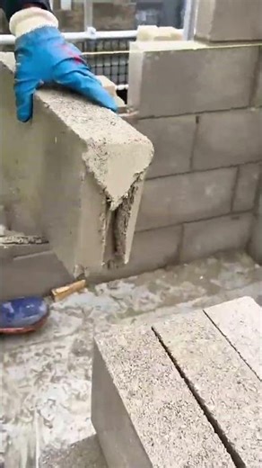 Using Cement Mortar To Install Heavy Concrete Blocks For Building A Strong New Wall