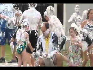 Swimmers celebrate with a shaving cream fight