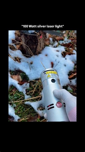 Knowledge | Curiosity | Discovery on Instagram: "The visual content showcases a high-powered 100-watt silver laser light being used to rapidly burn through organic materials and ignite foliage in a snowy outdoor environment. This demonstration leverages the psychological appeal of high-tech novelty and the primal fascination with concentrated energy, often categorized as a "viral power" trend that highlights the extreme capabilities of modern handheld electronics. The video fits into a broader t