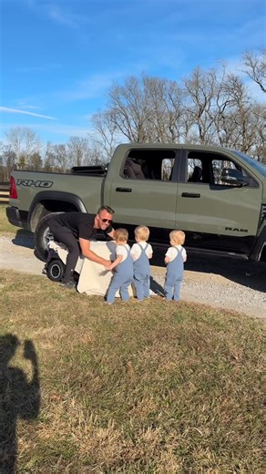 Jordan Flom on Instagram: "They are obsessed! 🎁. How are the Triplets 2 years old already? It’s time they get their own @ramtrucks #triplets #rambassador #mom #dad #truck"
