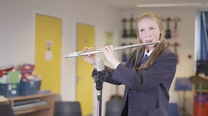 clip-22983034-4k-teen-girl-playing-flute-school-music