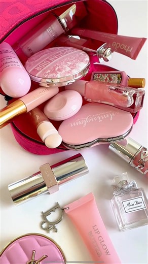 Lida Moradi Eghterafi on Instagram: "The pink Dior vanity everyone’s obsessed with 💗 Packing my mini Dior vanity case for a staycation — the ultimate edit of travel-size luxury must-haves and pink beauty essentials. 💼 What’s inside (alphabetically): • Dior Addict Lip Maximizer Plumping Gloss — 001 Pink • Dior Backstage Flash Perfect Concealer — 3N • Dior Forever Nude Bronze Glow — 031 Coral Bronze • Glow Recipe Watermelon Glow Niacinamide Dew Bomb Face Sunscreen Stick SPF 45 • Glossier You Sol