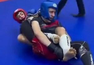 MMA fighter breaks his opponent's leg.