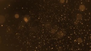 HD Golden Particle Background. Sparkling Abstract Glow for Christmas, New Year, and Festive Events.