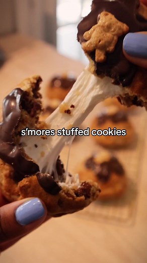 turns out this was just a period craving & I couldn’t even finish one💀 heres the recipe if youre hungry 😗 Ingredients 1 1/4 cup all purpose flour 3/4 cup cake flour 1 tsp. cornstarch 1/2 tsp. baking soda 1/2 tsp. baking powder 1/2 tsp. salt 8 Tbsp. butter, unsalted, cold, cut into cubes 1/2 cup brown sugar, packed 1/4 cup white sugar 1 large egg 1 large egg yolk 1 tsp. vanilla extract 1 whole sleeve graham crackers, crushed 1 cup milk chocolate chips Filling 6 regular size marshmallows Hershey