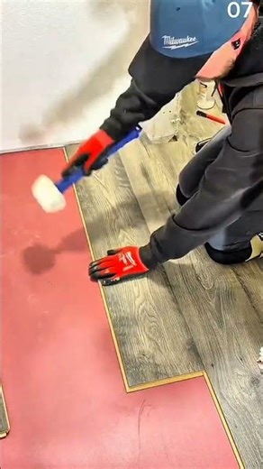 Fitting laminate planks using tapping block and mallet