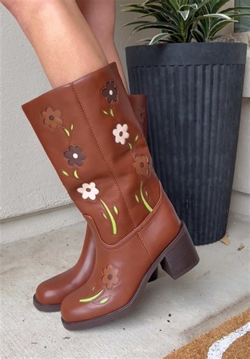 The cutest floral boots for spring and summer 🌼 mid-calf height, chunky heel, and easy pull-on style that looks so good with jeans, skirts, or flowy dresses. #boots #shoes #cuteshoes #concertoutfit #outfitinspo
