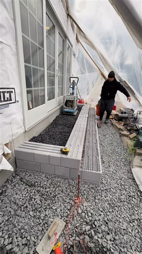 Jonathan Chiofalo on Instagram: "No excuses, just execution 😤 80 degree in my canopy while there’s snow outside in NJ.🌞☀️ Third and final stoop up, now time for slabs then the front stoop/ porch 🙌 #mason #hardscaping #stoop #lighting #craftsmanship"