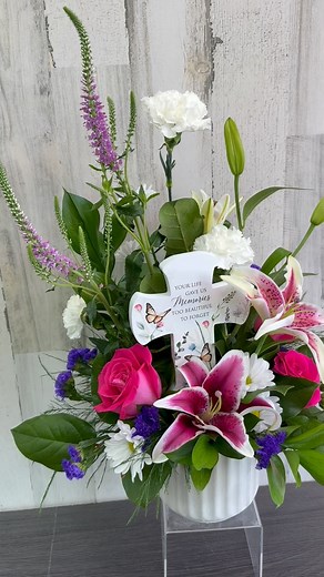 Check out a beautiful arrangement made in our store! We can add sympathy gifts to them for the recipient to keep afterwards! Remember we deliver 7 days a week!💐 | Flowerama Cedar Falls