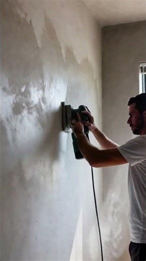 Skilled workers scrape paint off walls using special machines #shorts