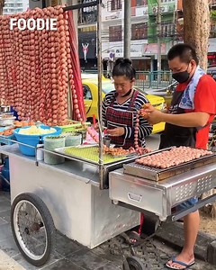 One of the most famous street food in Bangkok, Thai-style grilled tiny round sausage pork balls! 😍 | Foodie
