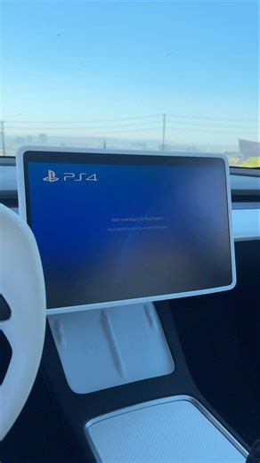 Loading Sony PlayStation 4 against the backdrop of Los Angeles