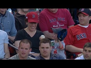 Teenage fan gives foul ball to young child