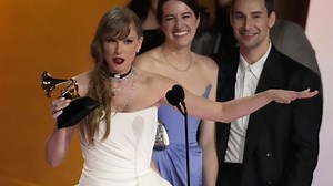 Taylor Swift wins album of the year at the Grammy Awards for the fourth time, setting a new record