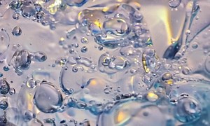 Water Bubbles Abstract Macro Photography: A close-up shot of water bubbles, capturing the ethereal beauty and intricate details of nature's artistry. The soft, iridescent colors and delicate textures Stock Video