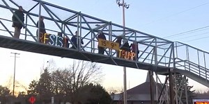 Lansing group holds ‘light brigade’ to protest Trump’s inauguration