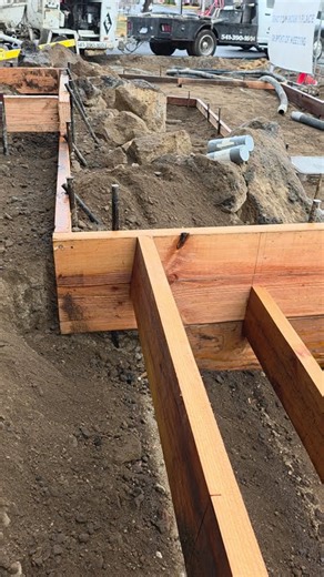 Concrete Stairs & Code — Why Commercial Risers Need Camber (Not Plumb)