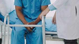 Physiotherapist assists her contented senior patient on folding walker. Recuperation for elderly, seniors care, nursing home.