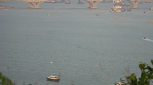 Ship traffic and a bridge - Free Stock Video