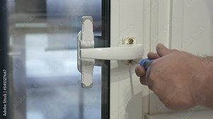 Replacement handles on pvc glass door window on the balcony. Child safety devices to protect children at home. Safety lock for door.