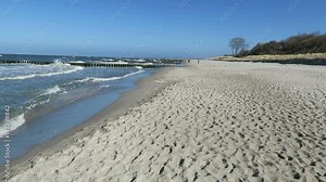 walking along the beach of ahrenshoop with its dunes and reed houses (Germany) Stock Video
