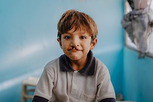 Part 2 of Samir's story!👇 Despite struggles, Samir found joy in simple things—playing marbles and soccer with his siblings, turning a rusty pipe into his own waterpark. Romina hesitated to send him to school, fearing bullying. Yet, Samir's family's love shielded him: "I was born this way because God sent me this way. As long as my father, mother, and brothers love me, I am happy." 💙 | Smile Train