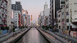 Download Osaka, Japan on September 30, 2023. The Dotonbori River separates Shinsaibashi and Namba, and the Dotonbori Bridge is the meeting point for these two neighboring areas.