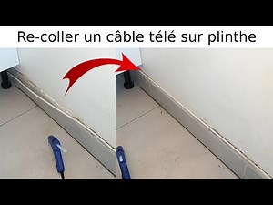 How to reattach and reattach a coaxial TV cable to a baseboard using a glue gun. Real Estate Tuto...
