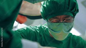 Surgeons team processing surgical operation in operating room emergency department at hospital. Heart surgery and major surgery.