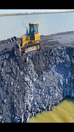 909K views · 7.4K reactions | Episode 02!Fantastic road construction project. Use trucks, a wheel loader, and a dozer Shantui to dump rocks into a sizable lake. It is truly amazing to study Project 1, which is a rapid construction of a road across a large river, with a team of experts pouring rocks into a lake, making it the site of a magnificent fish farm. | Lewis Mcinally | Facebook