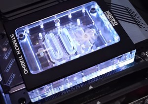 Stealth CPU water block hides tubing behind the motherboard
