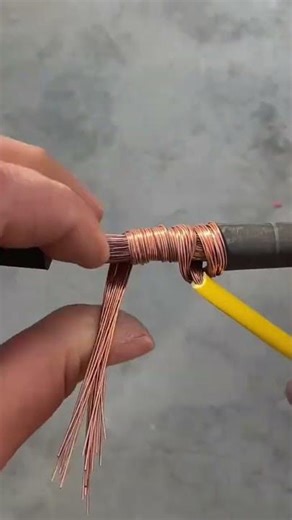 the process of winding or installing thin electrical cable wires on large, thick cables.