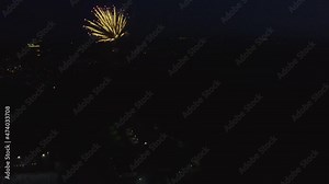 Fireworks over the city. Quadrocopter over the fireworks. Shooting fireworks from a copter. Flying through the fireworks.