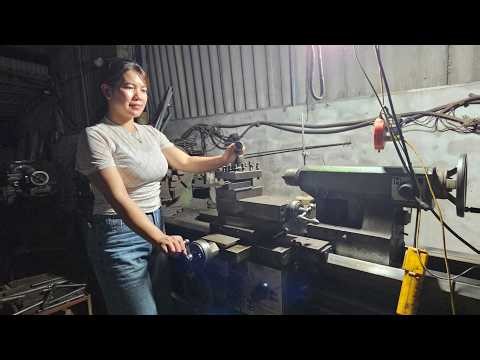 The girl disassembled the turbine shaft and took it to the workshop for maintenance.