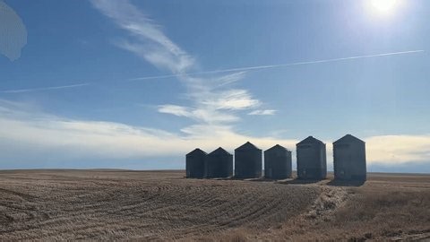 clip-4033140071-driving-past-centre-pivot-irrigation-system-across