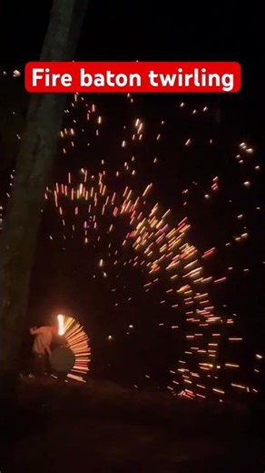 Fire baton twirling