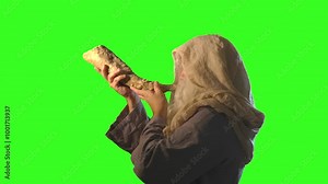 Jewish man blowing the Shofar horn of Rosh Hashanah New Year on green background Stock Video