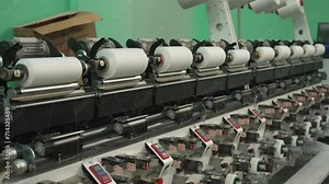 Production and winding of threads on spools in production