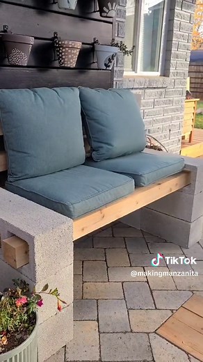 This cinder block bench was SO EASY! #ad Just stack the blocks and glue them together with DAP All Purpose Filler and Adhesive and fill with 4x4 wood posts! Check out the full tutorial on the blog for the details. #DIYwithDAP #outdoorbench #cinderblock #cinderblockbench