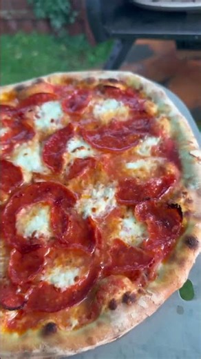 Cooking Wood-Fired Pizza in the rain with the Bertello SimulFIRE 16" Rotating Outdoor Pizza Oven.