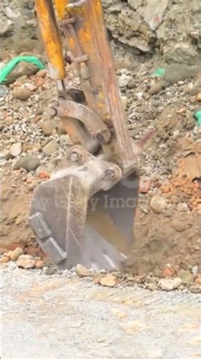 Engineer leveling ground with road roller