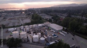 Industrial chemical processing plant with tanks and pipes, transport trucks, rail transport, heavy industry, economy. 4K 24FPS