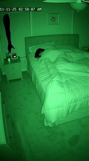 Ultra realistic CCTV night vision nanny cam inside a typical American suburban bedroom queen size b