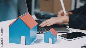 Real estate agent working sign agreement document contract for home loan insurance approving purchases for client with house model.