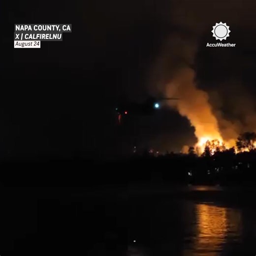 Crews battle the Pickett Fire in Napa County, California, as helicopters drop water from above. The blaze has burned 6,800 acres and is now 17% contained. | AccuWeather